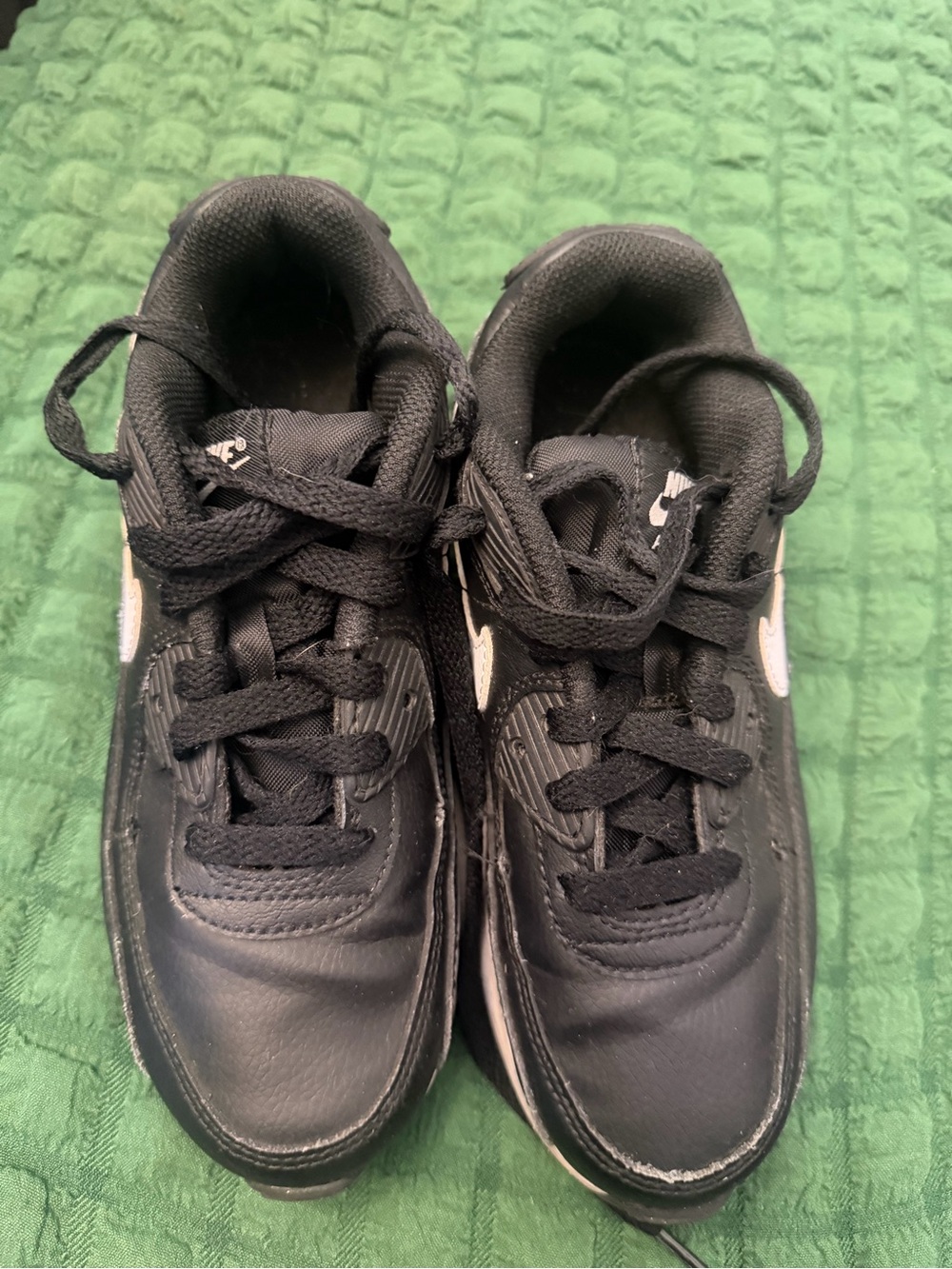 Nike Kids Black Sneakers with White Swoosh Accent